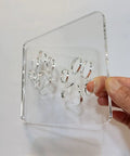 Close-up of Badass Double Paw Print Router Template for Heavy Duty Woodworking Resin Inlay Cavities Clear Quarter Inch Acrylic Stencil.