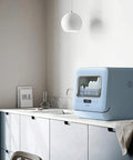 Pretty Slick Countertop Dishwasher Fully Automatic Stainless Steel With Six Place Settings LED Display And Delay Start Quick Connect Faucet Adapter Smooth Hassle Free Setup on kitchen countertop with LED screen.