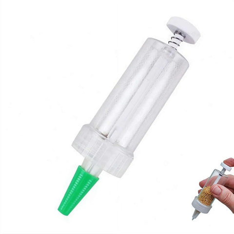 Mini Seed Spreader Handheld For Tiny Seeds 2025 Upgrade Seed Dispenser, compact plastic tool with green nozzle for precise sowing.