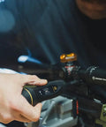 Hands using All In One Scope Mounting Kit With Laser Bore Sighter, Reticle Leveling System, and Fat Wrench on rifle scope.