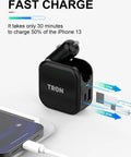 Game Changer 36W Fast Charger With Straight Up Dual Usb C And Universal Usb A Ports For Phones Tablets And Earbuds Compact Wall Car Adapter next to a smartphone.