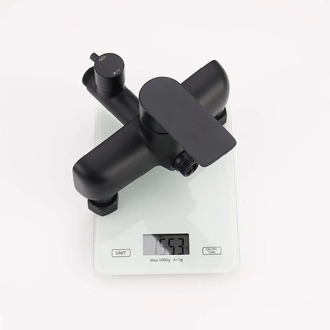 Exposed Shower System with Tub Spout 180° Rotating White faucet on a scale, showcasing modern black design and compact size.