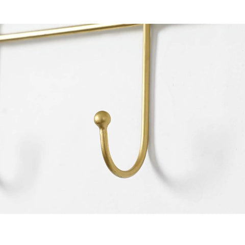 Close-up of gold hook from Heavy Duty Wall Mounted Coat Rack With Sturdy Hooks For Draping Jackets Hats And Outerwear In The Entryway Hallway Bedroom A Simple Setup That Keeps Your Daily Gear Straight Up Tidy.