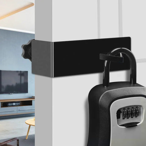Heavy Duty Door Mount Bracket For Lockboxes Featuring Slick Swivel Hooks And A Rock Solid Hold Perfect Realtor Essential Plus Vacation Rental Key Holder Quick Attach Black mounted on a door with a lockbox.