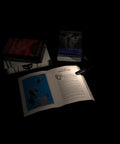 Grab And Go Clip On Book Light With 12 LED USB Rechargeable Battery illuminating open book on desk with other books