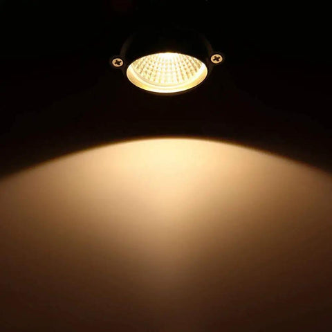 Close-up of lit 6 Pack Low Voltage Outdoor Landscape Lights 6W LED Spotlight Kit 12V 24V Waterproof Warm White Garden Lawn Yard Pathway Lighting With Easy Install For Patio Walkways And Outdoor Decor, highlighting the warm white glow.