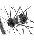 Close-up of 40mm Carbon Clincher Wheelset For Disc Brake Road Bikes Centerlock Rotor Mount 700c Black showing hub and spokes