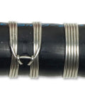 Close-up of Clamptite CLT05 4 And 3 Quarters Inch Plated Steel And Aluminum Tool With Wingnut clamp on black hose