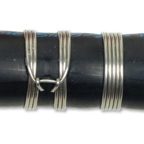 Close-up of Clamptite CLT05 4 And 3 Quarters Inch Plated Steel And Aluminum Tool With Wingnut clamp on black hose