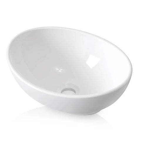 Premium Oval Ceramic Vessel Sink For Bathroom Vanity Countertop Glossy White Porcelain Bowl Above Counter at an angle showing smooth interior.