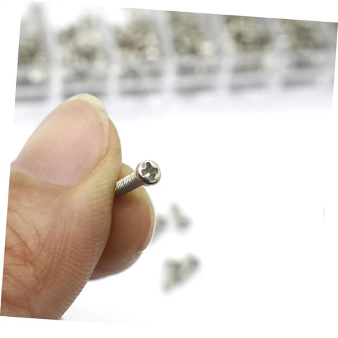 Close-up of a tiny screw from the Miniature Electronics Screw Kit For Repairs With Assorted Tiny Screws For Glasses, Watches, Laptops.
