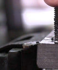 Close-up of 3/8-16 High Speed Steel 3 Flute Spiral Point Tap DWT Series Hand Tap used in threading metal