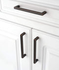 Oil Rubbed Bronze Solid Square Kitchen Cabinet Handles 5 Inch installed on white cabinets, showing smooth rounded corners