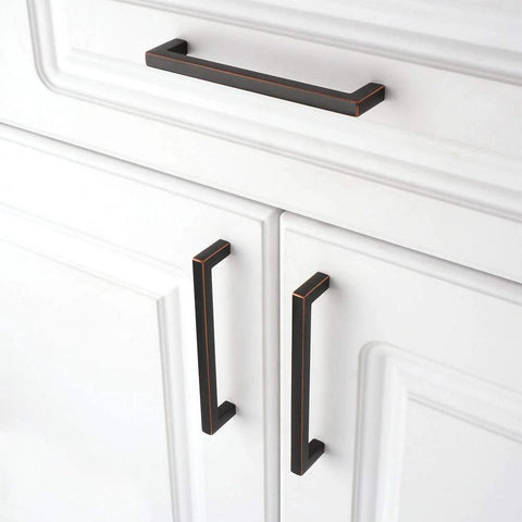Oil Rubbed Bronze Solid Square Kitchen Cabinet Handles 5 Inch installed on white cabinets, showing smooth rounded corners
