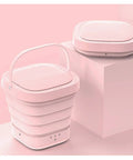 Portable Foldable Washing Machine Mini Washer Game Changer in pink, compact design with handle, ideal for travel or dorm.