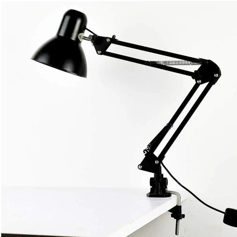 Rock Solid Desk Lamp Mount with Swing Arm Clamp Holder Fits Anything Under 12 Mm Tube for DIY Table Lamps and LED Fixtures, mounted on a white desk.