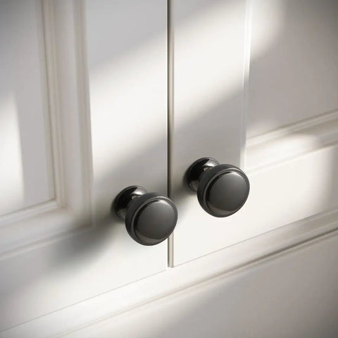 Six Pack Dope Polished Black 1.1 Inch Round Cabinet Knobs Solid Zinc Alloy Drawer Pulls in Dark Grey Gunmetal Finish on white cabinet