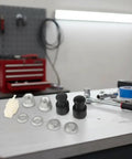 Must Have M12 EBike Hub Motor Axle Nut Kit with front lock nut, washer, and protective cover for 12mm shafts on workbench