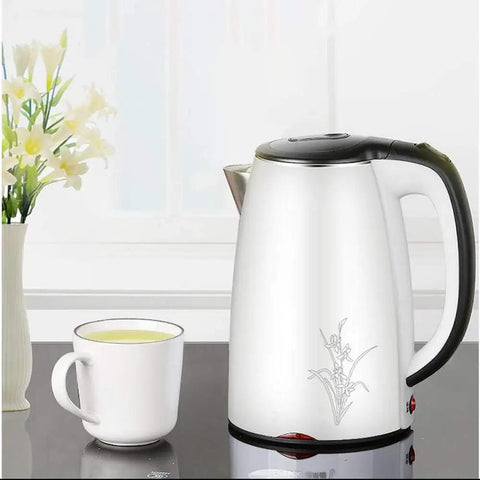 Heavy Duty 304 Stainless Steel Electric Kettle 1.7 Liter 1830 Watt Kicking Boils Fast next to a white cup of tea.
