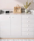 Solid White Wooden Cabinet Knobs For Furniture And Kitchen Upgrades Smooth Round Mushroom Drawer Pulls on a white dresser.