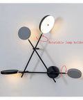 Top Shelf Round Led Wall Sconce Lighting For Bedroom Bedside Decor Featuring Smooth 360 Degree Rotation Matte Black Iron Industrial Loft Fixture Serving Clean Soft Glow with rotatable lamp holders.