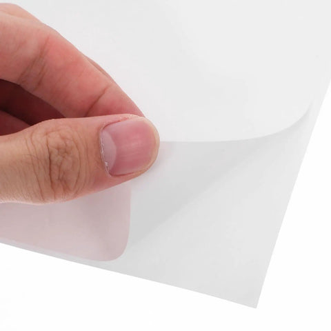 Close-up of 160 Sheets 4x6 Inch Waterproof Synthetic Paper Shipping Labels With Ample Writing Space peeled by hand