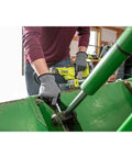 Person using Cordless Grease Gun Kit With 2.0Ah Battery And Charger, 10000 PSI High Pressure, 7.5 Oz Per Minute Flow on machinery