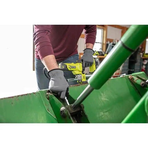 Person using Cordless Grease Gun Kit With 2.0Ah Battery And Charger, 10000 PSI High Pressure, 7.5 Oz Per Minute Flow on machinery