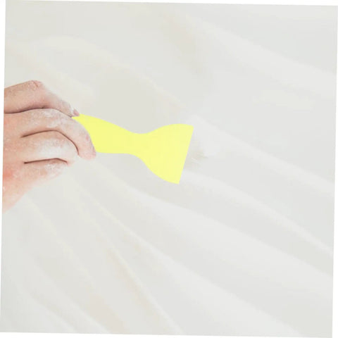Hand using scraper from Two Set Wall Mending Cream Kit Quick Drying Drywall Crack Repair Paste for easy crack fixes