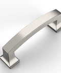 Modern stainless steel cabinet pull handle on a white background, angled view