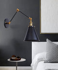 Heavy Duty Metal Swing Arm Wall Sconce With Slick Black Finish And Smooth Swivel Joint For Cozy Bedroom Reading And Chill Hallway Ambiance That Drops Major Style Points On Any Wall, featuring black metal and gold accents.
