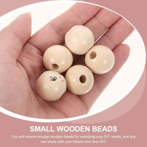Hand holding 14mm Round Wooden Smile Face Beads Set, 50 Pieces Doll Head Wood Beads, Loose Beads for DIY crafts