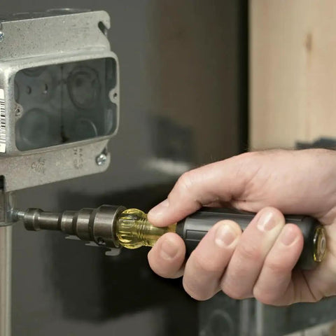 Person using Workhorse Reaming Driver Kit With Conduit Reamer And Magnetic Level For Quick Wire Runs on electrical box, 3-piece set displayed.