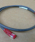 Single Industrial Ethernet Connection Cable R911171947 for Automation and Motion Control Systems on brown background.