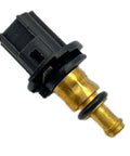 Coolant temperature sensor with brass body and black plastic connector (close-up)