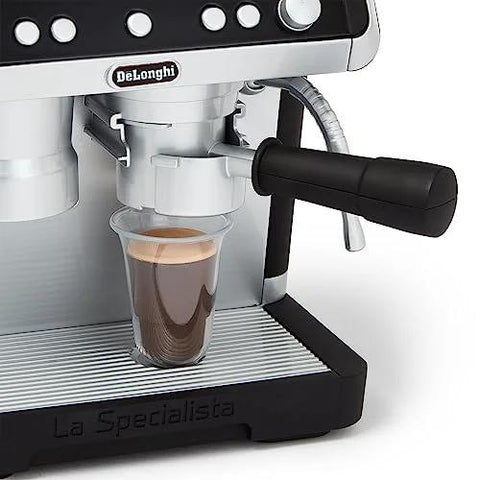 Close-up of Casdon De'Longhi toy barista coffee machine in silver/black with portafilter over a cup