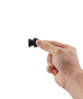 Hand holding Low Profile Trailer Door Holder Kit Rubber Door Stop Bumpers For RV Camper And Trailer Keep Doors From Slamming Hands Free
