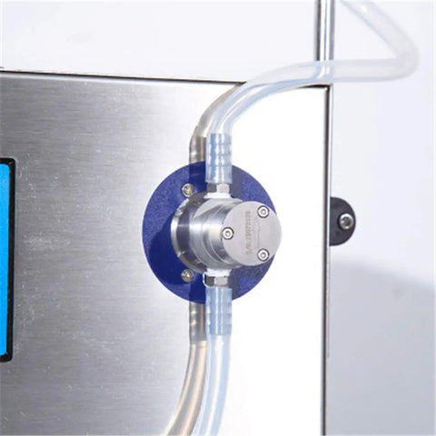 Magnetic pump close-up of Plug And Play Double Head Liquid Filling Machine With Magnetic Pump And Digital Speed Controls.