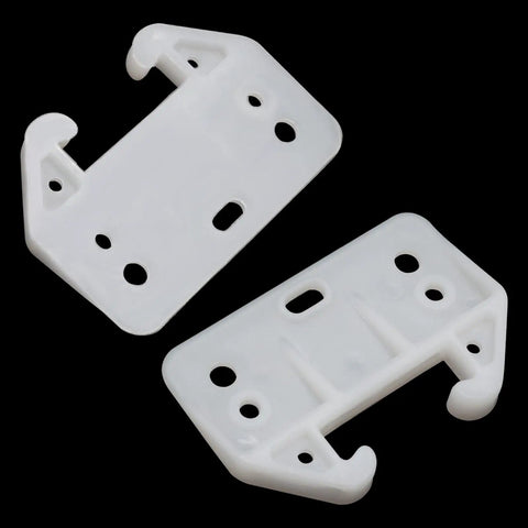 Banish Sticking Drawers Forever With These White Plastic Center Mount Slide Kits showing two slider brackets with holes for easy installation.