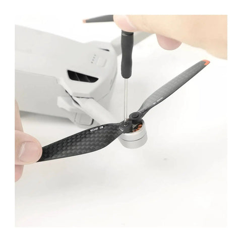 Premium Carbon Fiber Propeller Blades Compatible with Mini 3 Pro and Mini 4 Pro shown being installed with screwdriver.