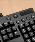 Top Shelf Mechanical Gaming Keyboard With Hella Responsive Switches Backlit Full Size Wired Usb Layout Splash Proof Build And Ultra Slim Matte Finish For Snappy Typing Days close-up of function and number keys on black keyboard.