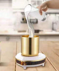Pouring milk into a gold cup on the Two In One Desktop Beverage Warmer And Rapid Chiller Pad for Coffee Milk Tea Hot Chocolate.
