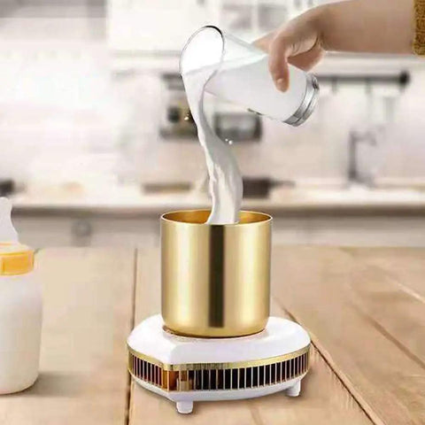 Pouring milk into a gold cup on the Two In One Desktop Beverage Warmer And Rapid Chiller Pad for Coffee Milk Tea Hot Chocolate.