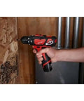 Heavy Hitter Cordless Compact Rotary Hammer Drill Driver Kit Featuring Variable Speed Trigger and Knockout 275 Lbs Torque Output in use drilling into wood.