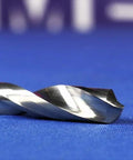 DMOD Series One Eighth Inch Solid Carbide Drill Bit Built For Tough, Abrasive Materials And High Temp Drilling, close-up view on blue.