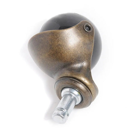 4pcs Inch Antique Bronze Ball Caster Wheel Swivel Chair Furniture close-up of bronze caster with black ball for furniture mobility