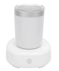 Keep Your Daily Sips Fresh And Hot With This Smart Dual Mode Coffee Mug That Effortlessly Heats Or Chills Drinks To Custom Temps For Laid Back Vibes Or Busy Grind, white electric coffee mug on charger.