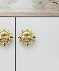 Solid brass antique finish Sun Moon Cabinet Knobs Set installed on white cabinet doors, showing celestial design and rust resistance.