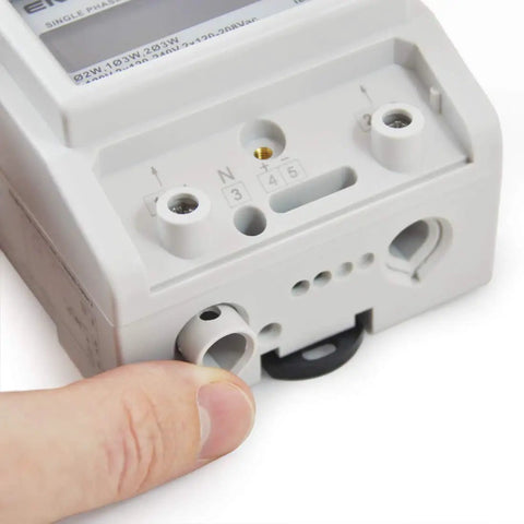 Close-up of Single Phase kWh Meter for Home and Shop Use, 2 or 3 Wire, showing connection ports and part of an LCD display