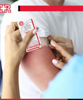 Person applying dressing from Grab And Go Burn Care Kit With All Natural Tea Tree Oil Gel And Dressing For Common Burns And Scalds